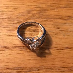 A back and white diamond heart ring.